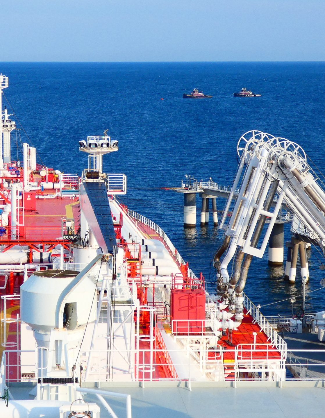 LNG at loading operation with tugboats